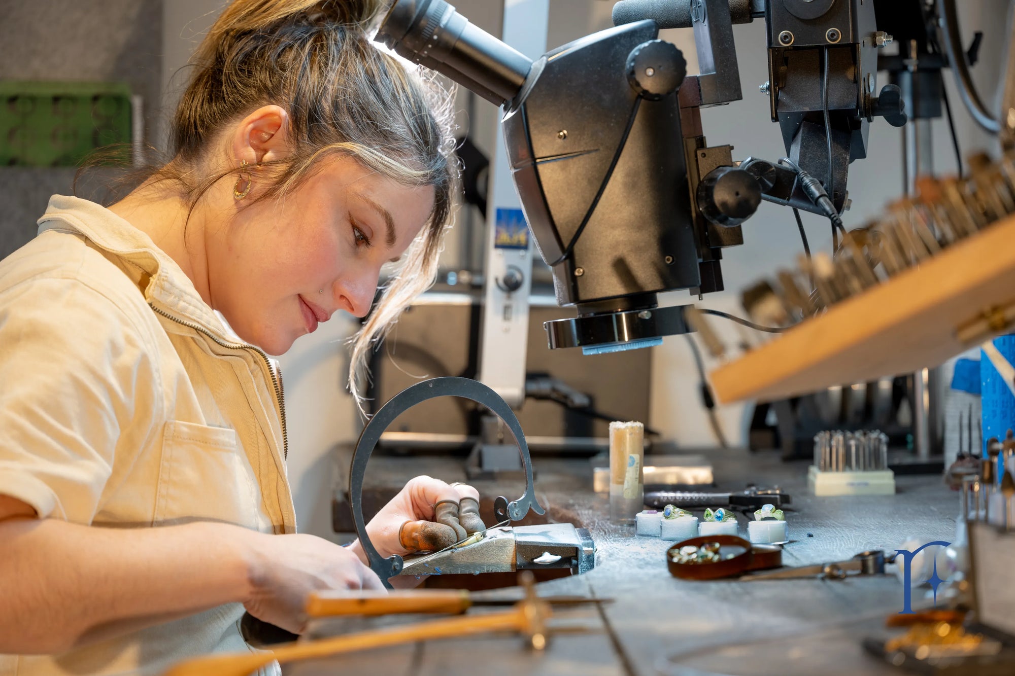 Ruinette artist Jamie Roth is pictured working at her bench in her studio, sawing a rough casting with a Green Lion saw