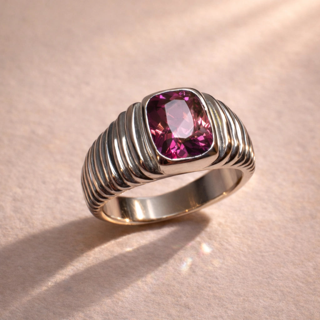 Close up of a custom handmade ring by Ruinette, featuring a pink rubellite tourmaline set in 18k white gold