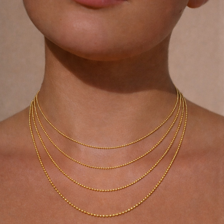 Ruinette Bead Chain Necklace, product-view, 18k yellow gold. Handcrafted luxury necklace, worn view, perfect for an elegant gift.