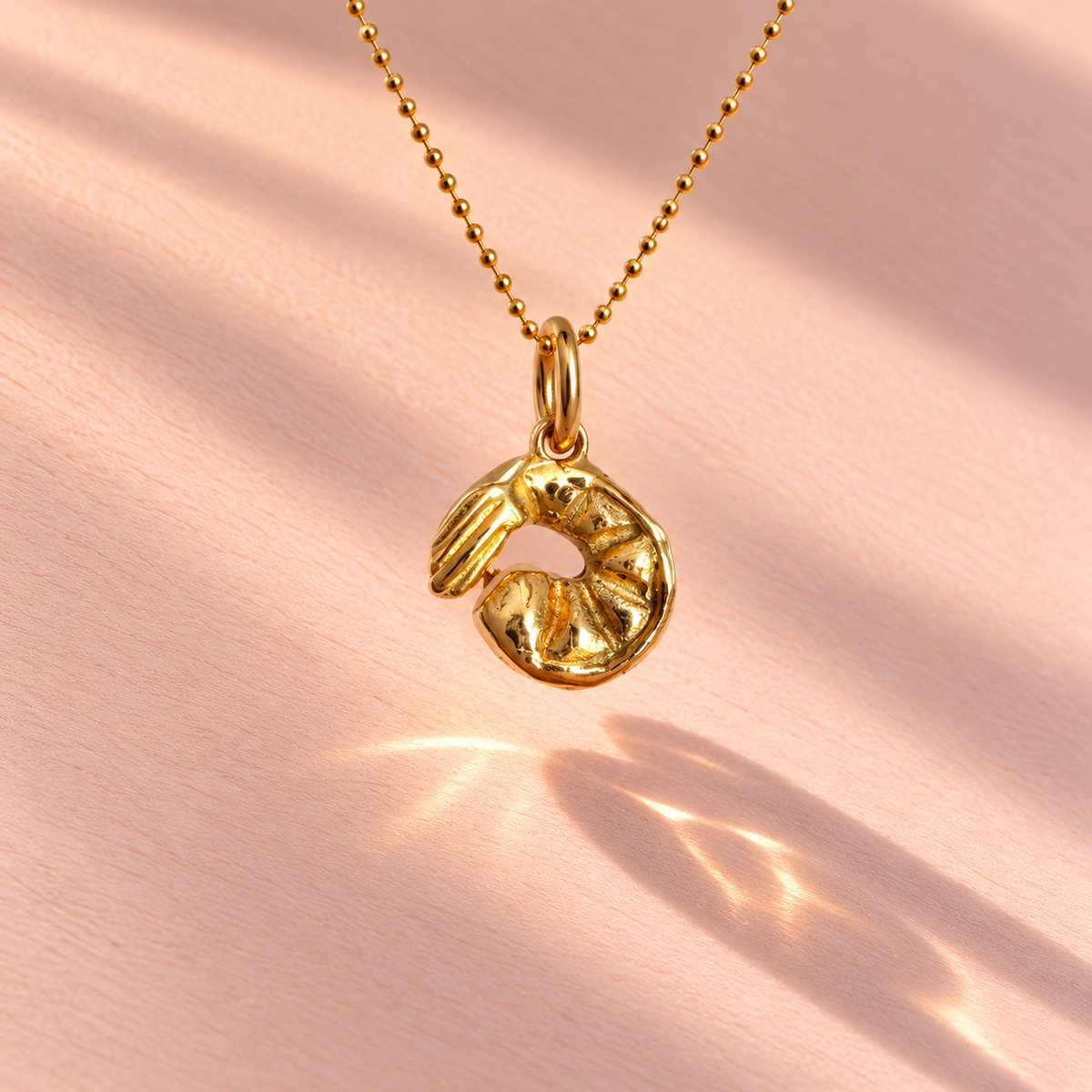 This deep pink marquise bezel-set charm exhibits a lovely stone color that complements the Ruinette Bijoux Cocktail Shrimp Charm design.