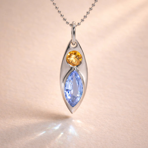 Ruinette Kitty Cat Charm No. 1  in 18k white gold featuring round peach imperial topaz and marquise-cut lavender spinel navette pendant on ball chain, front view