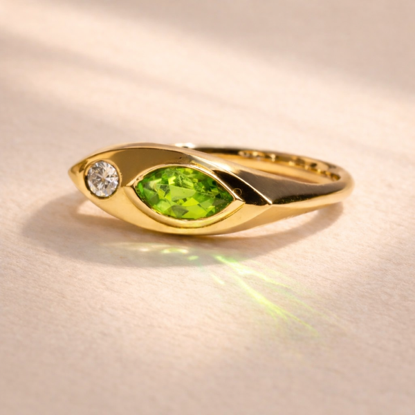 Kitty Cat Ring no. 01 front view showcasing 18k yellow gold with marquise peridot and brilliant cut diamond. Handcrafted by Ruinette Bijoux, perfect for unique gift occasions.