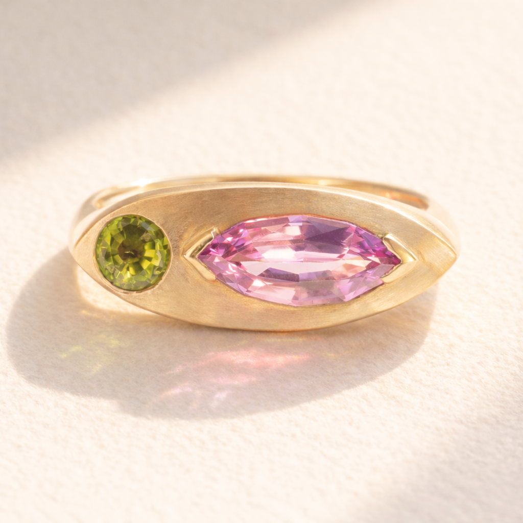 18k yellow gold ring adorned with pink sapphire and peridot. Kitty Cat Ring no. 02 front view offers luxury design perfect as a handcrafted jewelry gift.