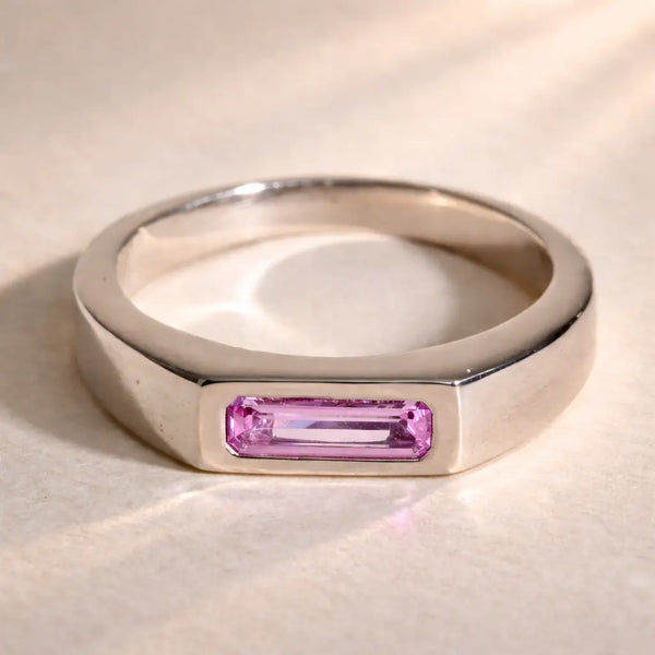 Ruinette Sapphire Stacking Signet Ring in 18k white gold featuring baguette-cut pink sapphire in bezel setting, front view