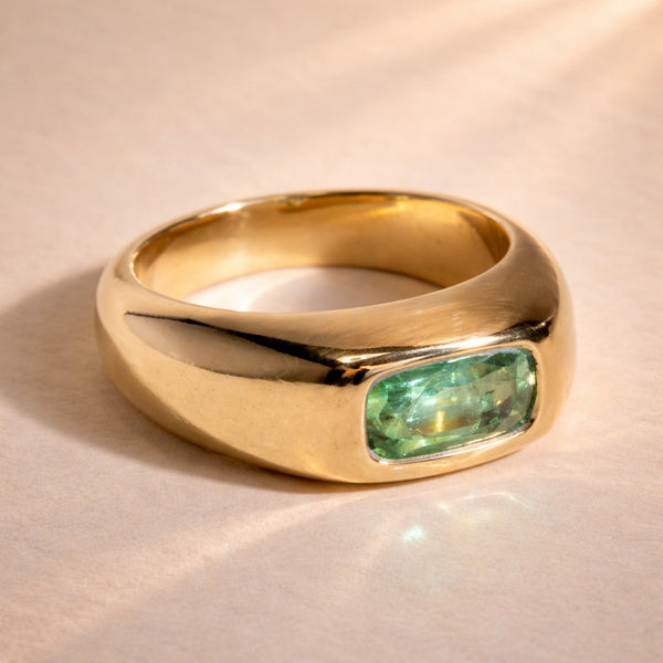 Ruinette Sophie Tourmaline Bombé Ring front angle showing bezel-set green Afghan tourmaline in wide 18k yellow gold bombé design with high polish finish