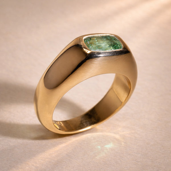 Ruinette Sophie Tourmaline Bombé Ring featuring cushion-cut green Afghan tourmaline set in polished 18k yellow gold domed band, side angle view